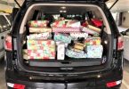 The back of the Manager Brad Robb’s car packed full of presents on their way to Community Action