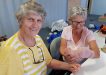 Katrina from QCWA practices bandaging techniques on YAP volunteer Julie