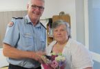 Lillian Clark being presented with her 40 years of service medal by Acting Assistant Commissioner, Ian Tar