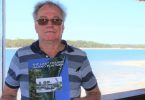 Author of The Last Fraser Island Puntmen, Allan Shillig with his book - the cover was designed by 12-year-old Aiden Obst who also helped with the layout and taught Allan how to edit