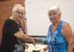 Probus president, Jo Said, with new member, Barbara McKenzie, cutting her 80th birthday cake
