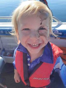 Grandson of club members Jane and Selwyn Potter – first time squid fishing “Just got inked” 