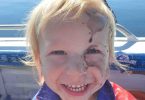 Grandson of club members Jane and Selwyn Potter – first time squid fishing “Just got inked”