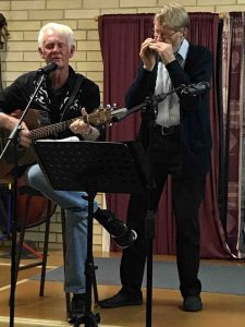 Ron on guitar and Len on harmonica at a Music Plus event pre Covid 