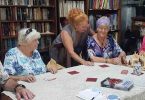 Bruce, Marie, Carolyn, Mary and Fiona enjoying friendly banter while strategising their chess moves at the Men’s Shed!