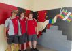 Year 9 students Rakeen, Blake and Mark, who are helping to complete the artwork at the Multi Purpose Space at Tin Can Bay school
