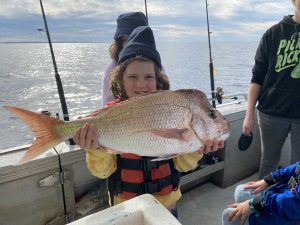 Great catch for 8-year-old Fe - a nice snapper!