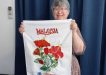 Dianne holds her International Creative Tea Towel Competition entry!