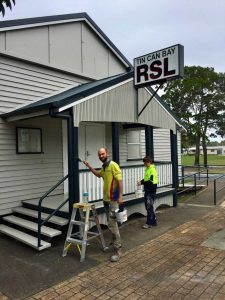 David and Sarah put finishing touches to painting the Tin Can Bay RSL