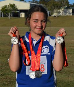 Anjelica Geurts with her haul of silver medals from the Gympie Athletics Spring Carnival