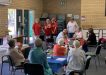 Joan Barnier, Judy Kiddle, Maggie Travers, and Barbara McKenzie singing "Our Wheelies up in front!" at the Cuppa in Cooloola