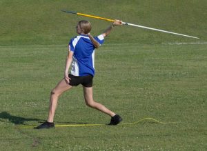 Janae demonstrates the javelin throw