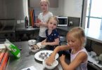 Taya, Xaiya, and Hazel making protein balls during one of our cooking sessions