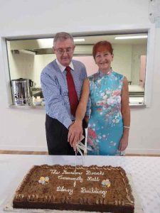 From the RBCN archives: (Then) Mayor Cr Ron Dyne and Sandy Brosnan, (then) President of the Rainbow Beach Community Hall Association Inc, cutting the cake to open the Community Hall on 24 February 2012