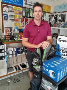 Professional Golfer James Taylor with new stock in the Pro Shop