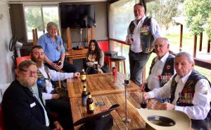 President Don Holland enjoying a well-earned drink with members of the Eureka Mob of Vietnam Veterans after last year's commemoration.