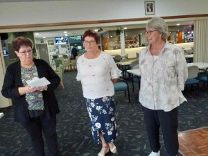 Sandra and Janet making a farewell presentation to Judy Hammond.