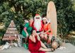 Santa and his elf last year with event organiser Elisa Seul and sleigh co-pilot Di from Rainbow Beach Helicopters. Get yourself on Santa’s nice list this year and visit him on 11 December.