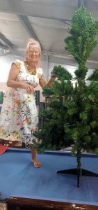 Where would we be without Yvonne? Here she is happily starting work on decorating our Christmas tree. What a star!