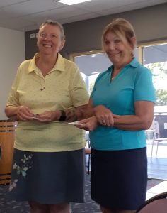 Gayl Rose receiving the 2nd Division Monthly Medal from Deidre Henderson